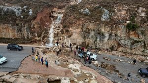 People stuck on a road after a powerful storm and heavy rainfall hit Shahhat city in Libya