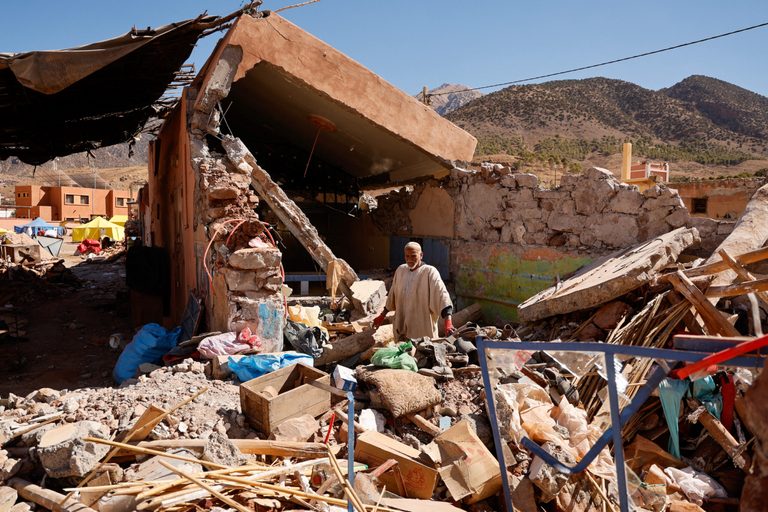 Ait Abdellah Brahim, an 86-year-old man from Talat N'Yaaqoub, surveys the rubble
