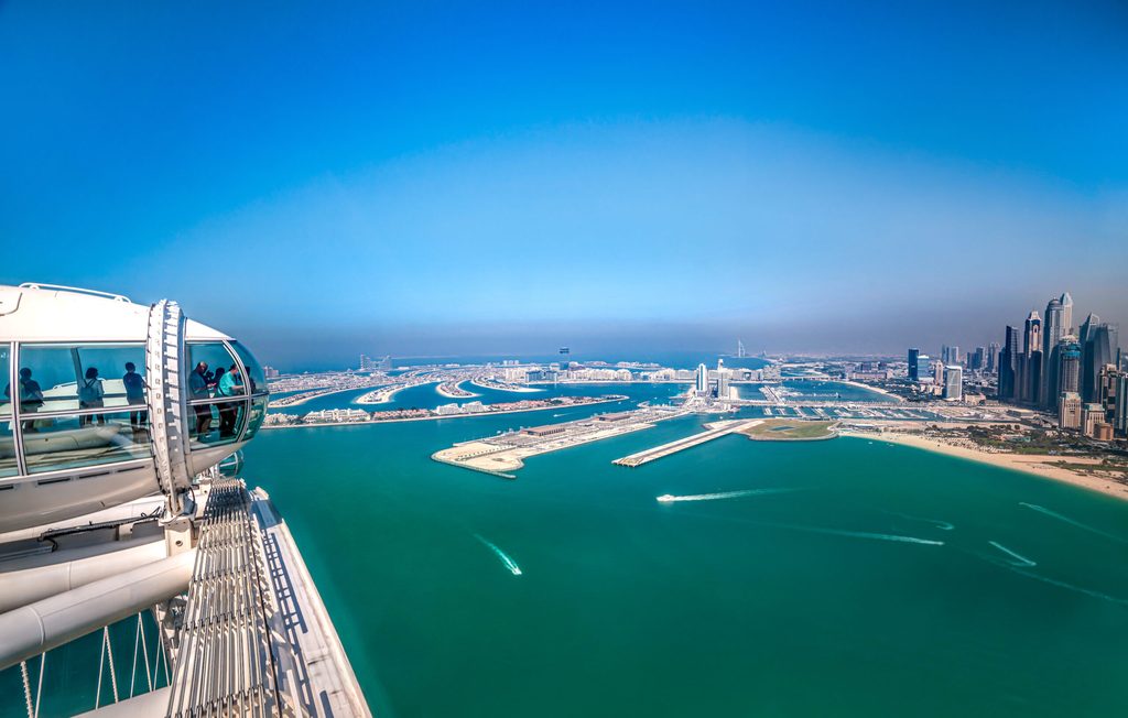 Passengers on the Ain Dubai wheel look out over Palm Jumeirah – now a popular spot for Russian property investors