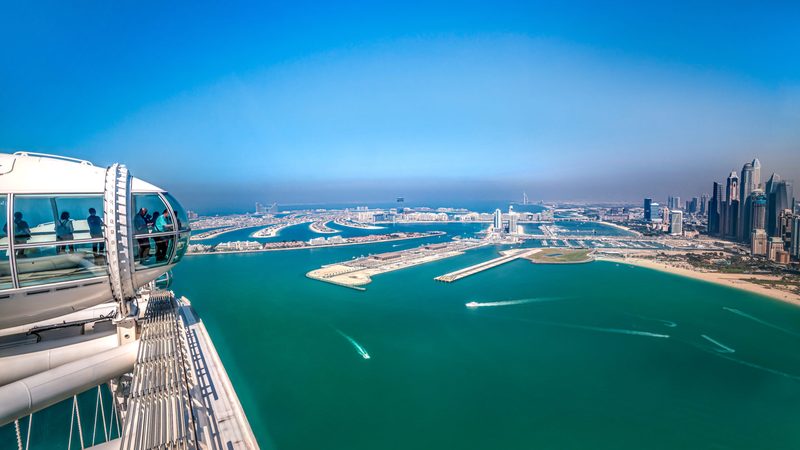 Passengers on the Ain Dubai wheel look out over Palm Jumeirah – now a popular spot for Russian property investors