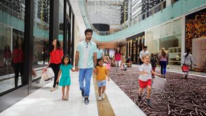 Families at Dubai Mall. The PMI figures on discounts come despite the Summer Surprises shopping festival held in August