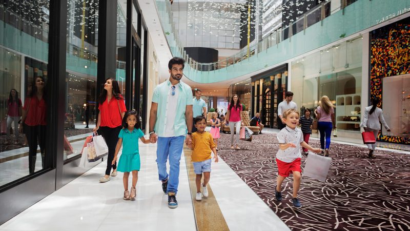 Families at Dubai Mall. The PMI figures on discounts come despite the Summer Surprises shopping festival held in August