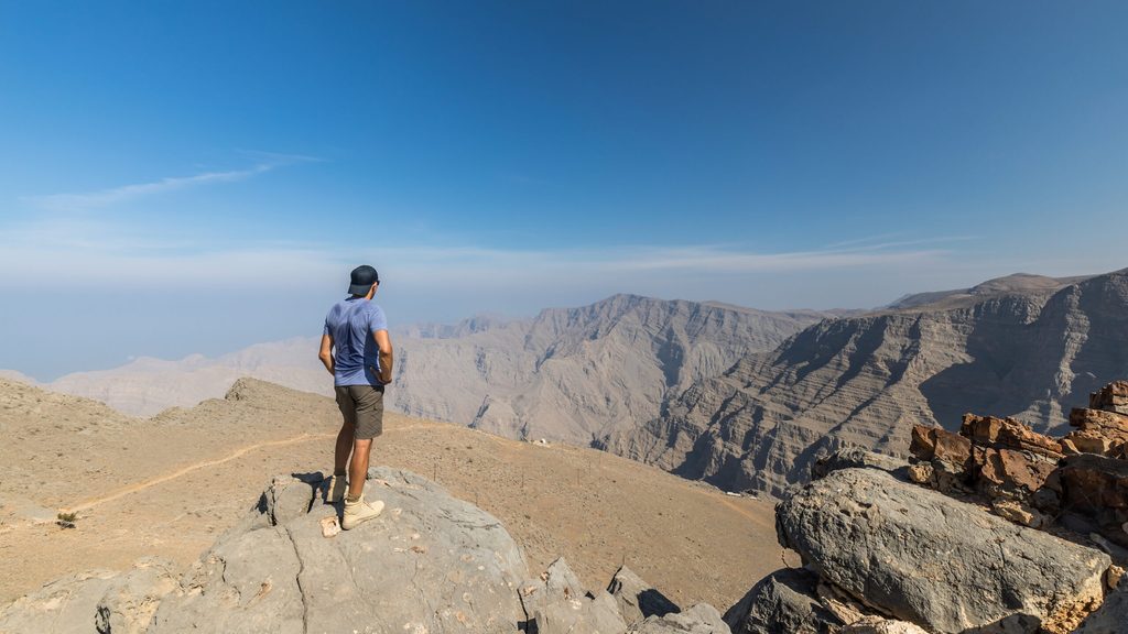 A hiker on Jebel Shams mountain in Ras Al Khaimah, the highest point in the UAE. Tourism and renewables will remain 'major diversification engines' in the GCC economies
