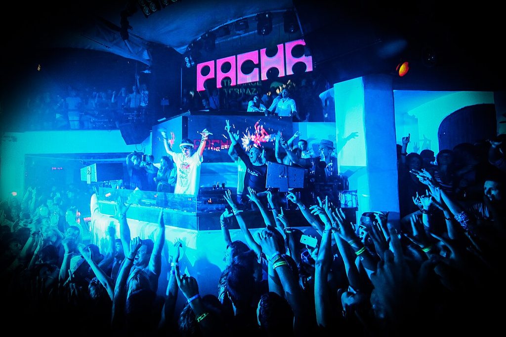 DJs and people dancing in the nightclub Pacha Five Holdings has completed the purchase of the hotel and nightclub businesses of Ibiza’s Pacha Group