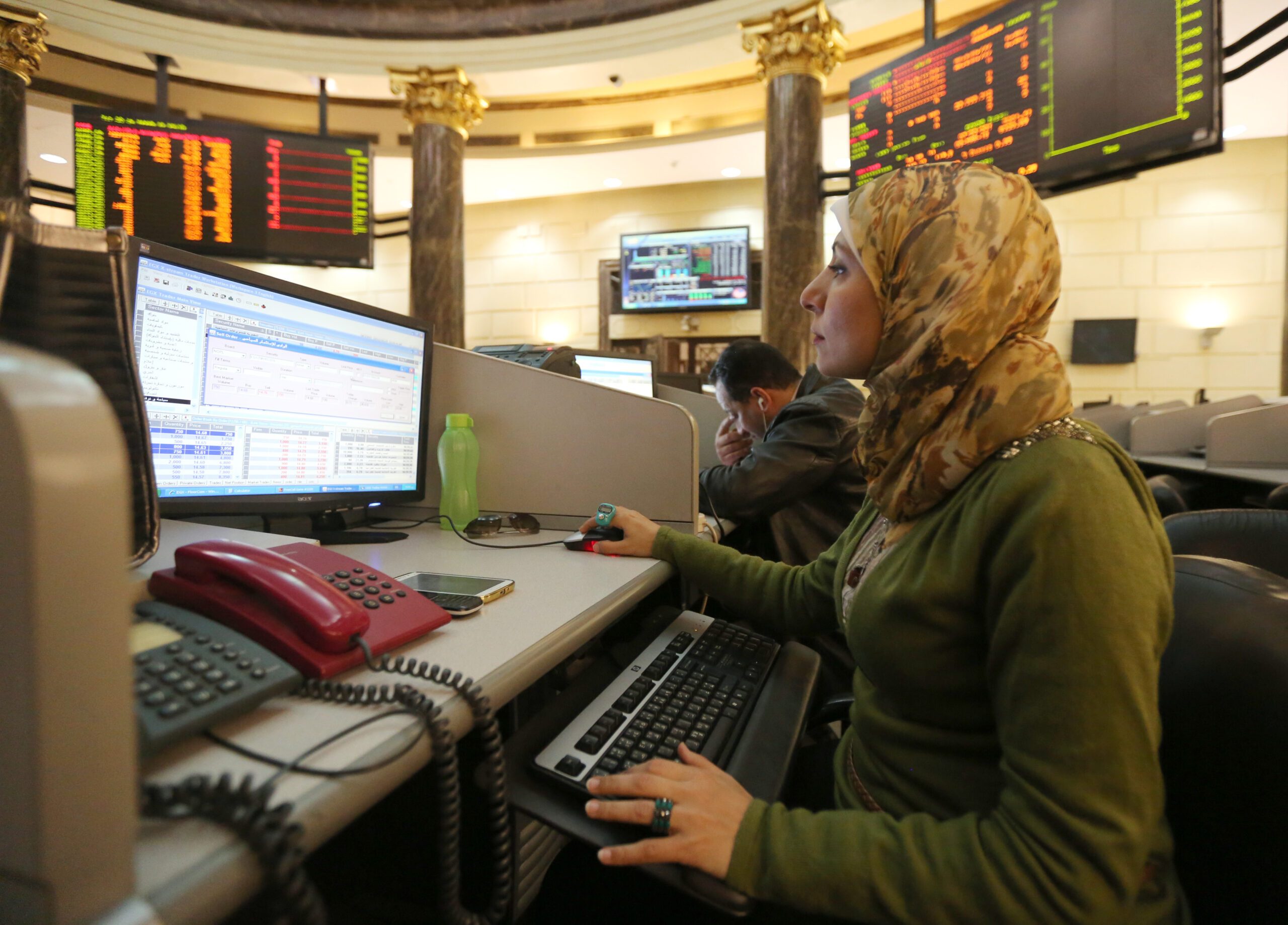 A trader at the Egyptian stock exchange in Cairo. Qatar has already invested over $5.5bn in Egypt's financial, real estate and energy sectors