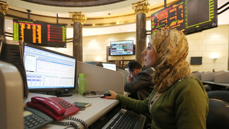 A trader at the Egyptian stock exchange in Cairo. Qatar has already invested over $5.5bn in Egypt's financial, real estate and energy sectors