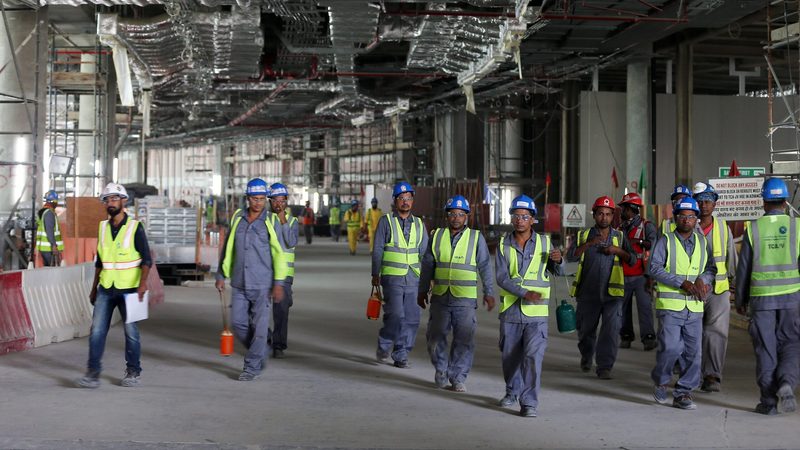 Labourers at Abu Dhabi airport's new terminal, set to open in November. Construction is one of the sectors driving non-oil growth in Q2