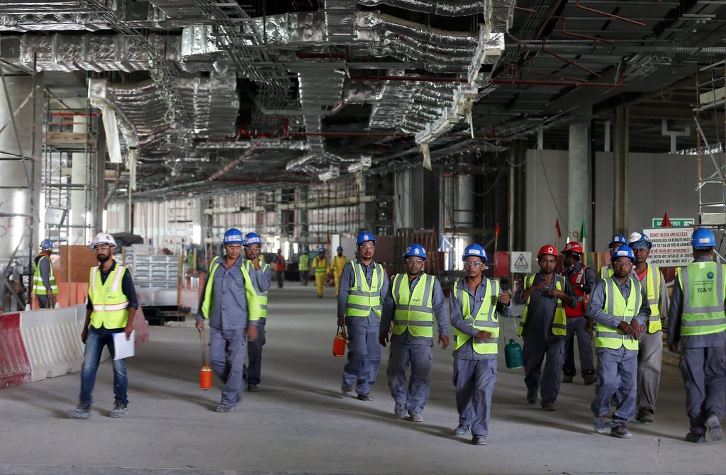Labourers at Abu Dhabi airport's new terminal, set to open in November. Construction is one of the sectors driving non-oil growth in Q2