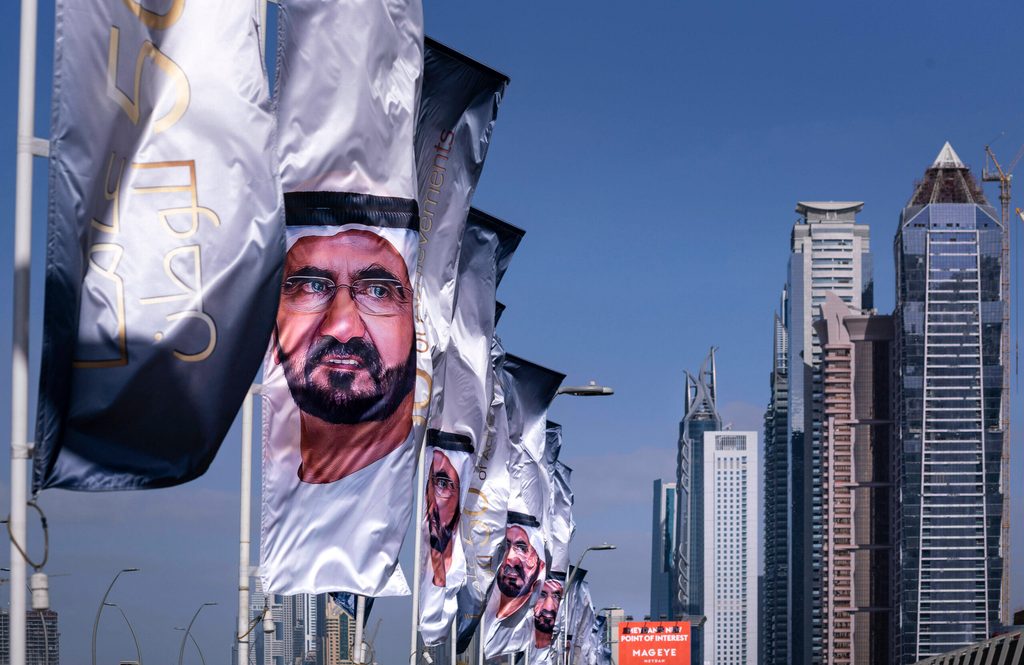 Flags in Dubai show the face of Sheikh Mohammed bin Rashid Al Maktum. Intellectual property laws regarding ownership of everything from images to music to inventions are being tightened