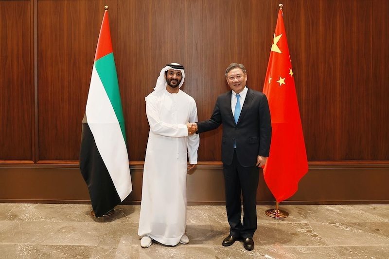 UAE economy minister Abdulla bin Touq Al Marri and China's commerce minister Wang Wentao meet at a conference in Guangzhou, China 