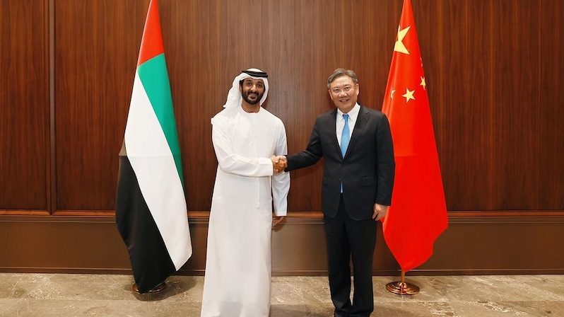 UAE economy minister Abdulla bin Touq Al Marri and China's commerce minister Wang Wentao meet at a conference in Guangzhou, China 