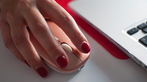 Hand about to click computer mouse