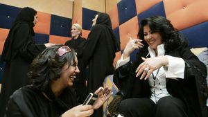 Saudi profiessional women having a conversation and laughing
