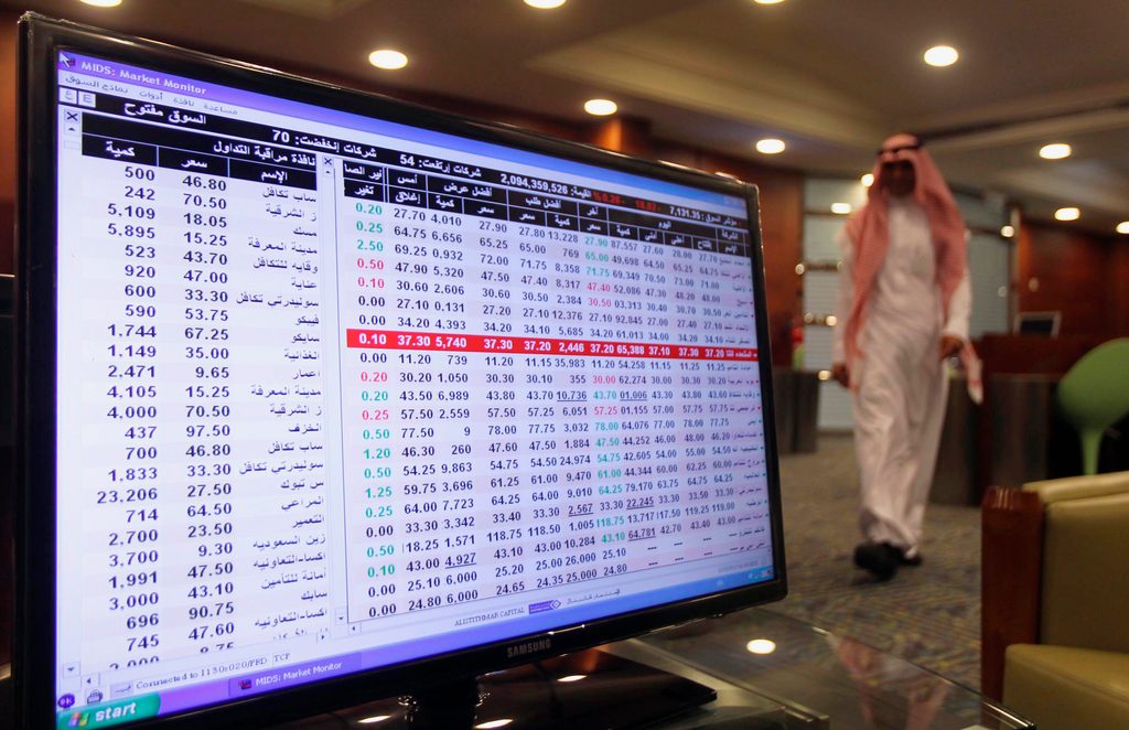 A screen displaying stock market index is seen at the Saudi stock market in Riyadh