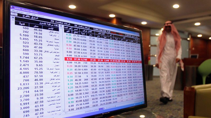A screen displaying stock market index is seen at the Saudi stock market in Riyadh