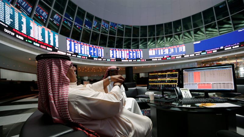 Traders at the Bahrain stock market. New platform Absolute Collateral will enable banks within each country to trade bonds together