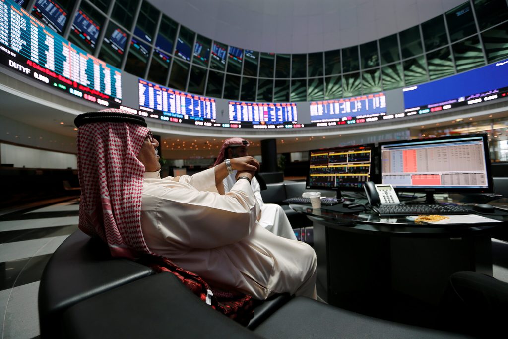 Traders at the Bahrain stock market. New platform Absolute Collateral will enable banks within each country to trade bonds together