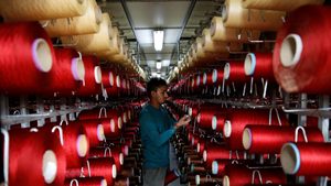 An employee at a factory in Jordan.