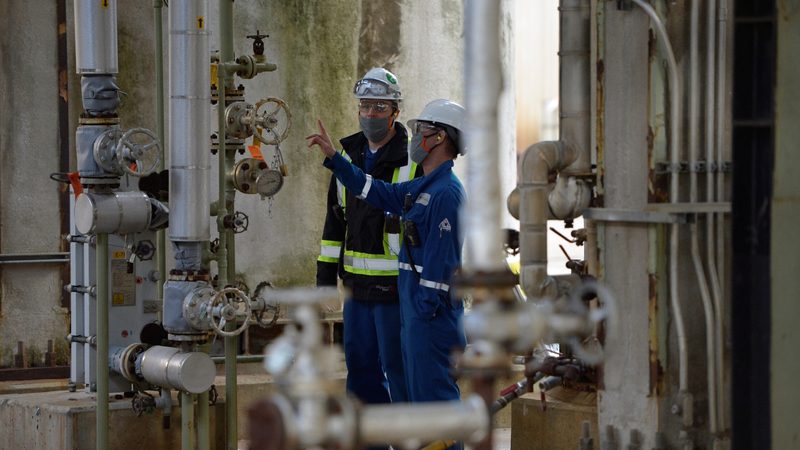 Workers at an oil refinery in British Columbia. New supply has opened up in Venezuela, Brazil and Guyana, as well as Canada
