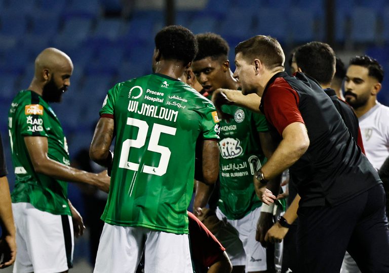 Al Ettifaq coach Steven Gerrard gives instructions to his players during a match against Al Tai. Gary Neville has no plans to follow his former England teammate to the Saudi Pro League