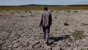 A farmer walks on a dried lakebed in Turkey. The UAE's water paper says 1.8 billion people live under conditions of absolute water scarcity