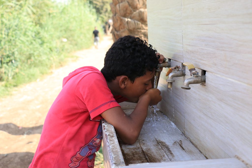 Drinking water from an outdoor tap in Egypt