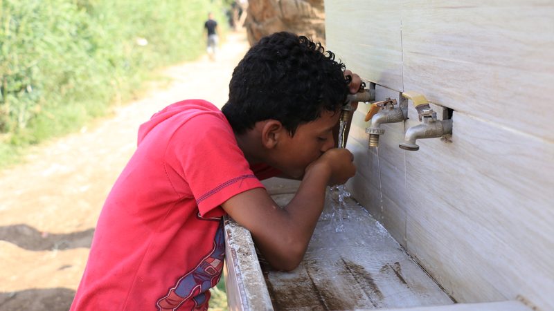 Drinking water from an outdoor tap in Egypt
