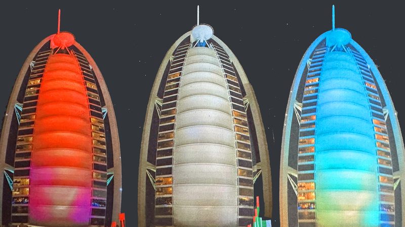 The Burj al Arab, Dubai, in three of its colour phases: the Cop28 occupancy boost for UAE hotels means the city will be close to full capacity