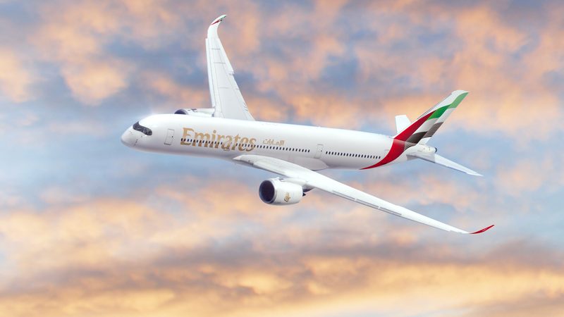 Emirates will be adding to its fleet, which currently consists of A380s and Boeing 777s (pictured) plane sky clouds Dubai, UAE November 16, 2021: A Boeing 777X aircraft on aerial display at the Dubai Airshow