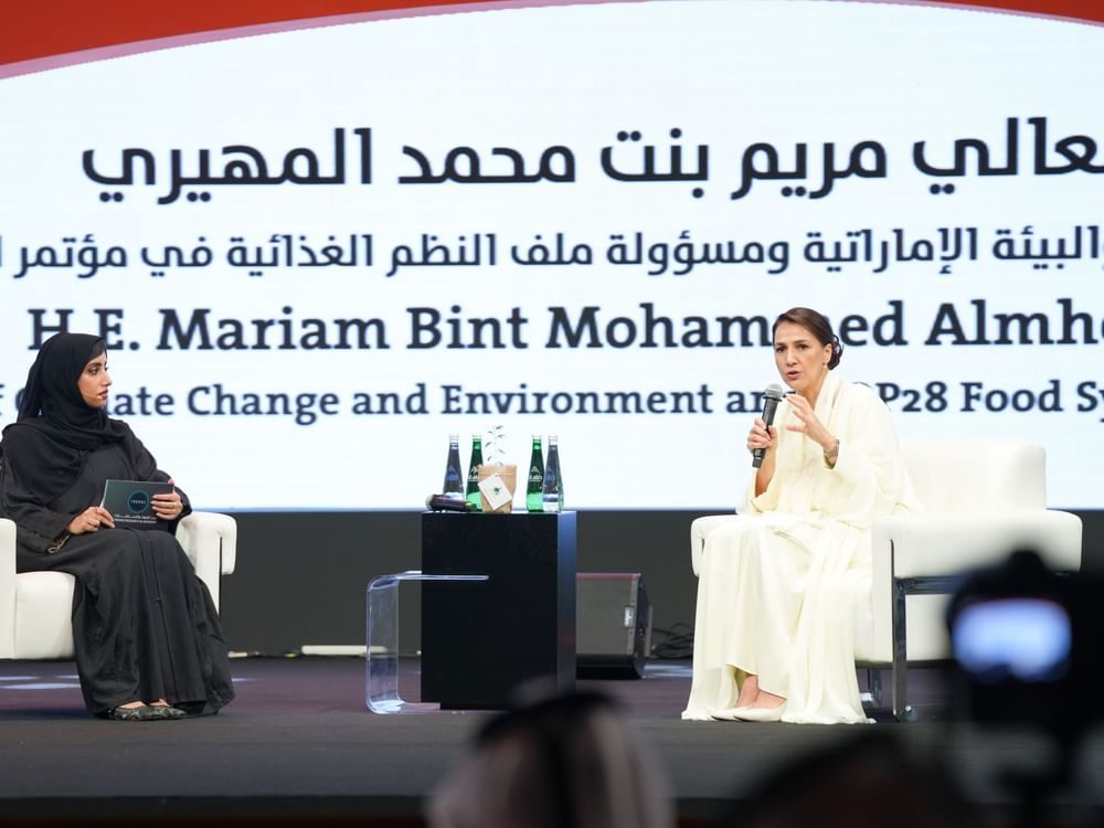 The UAE minister of climate change and environment, Mariam Almheiri, right