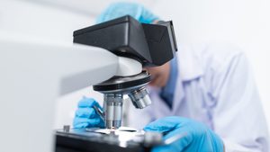 Investors are looking closely at opportunities in the healthcare sector scientist medicine microscope