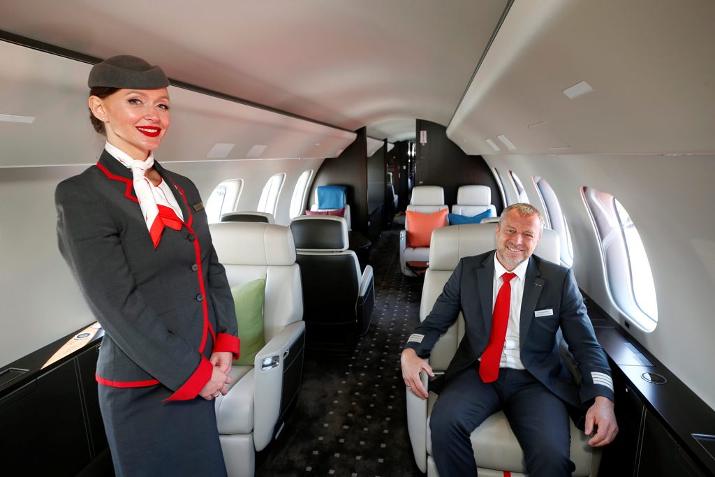 Cabin crew member Anna Orszulik and pilot Wilfried Woelfel in a VistaJet Global 7500: the company offers 'an alternative to private jet ownership'