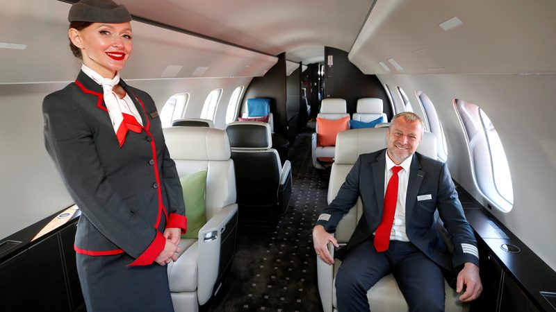 Cabin crew member Anna Orszulik and pilot Wilfried Woelfel in a VistaJet Global 7500: the company offers 'an alternative to private jet ownership'