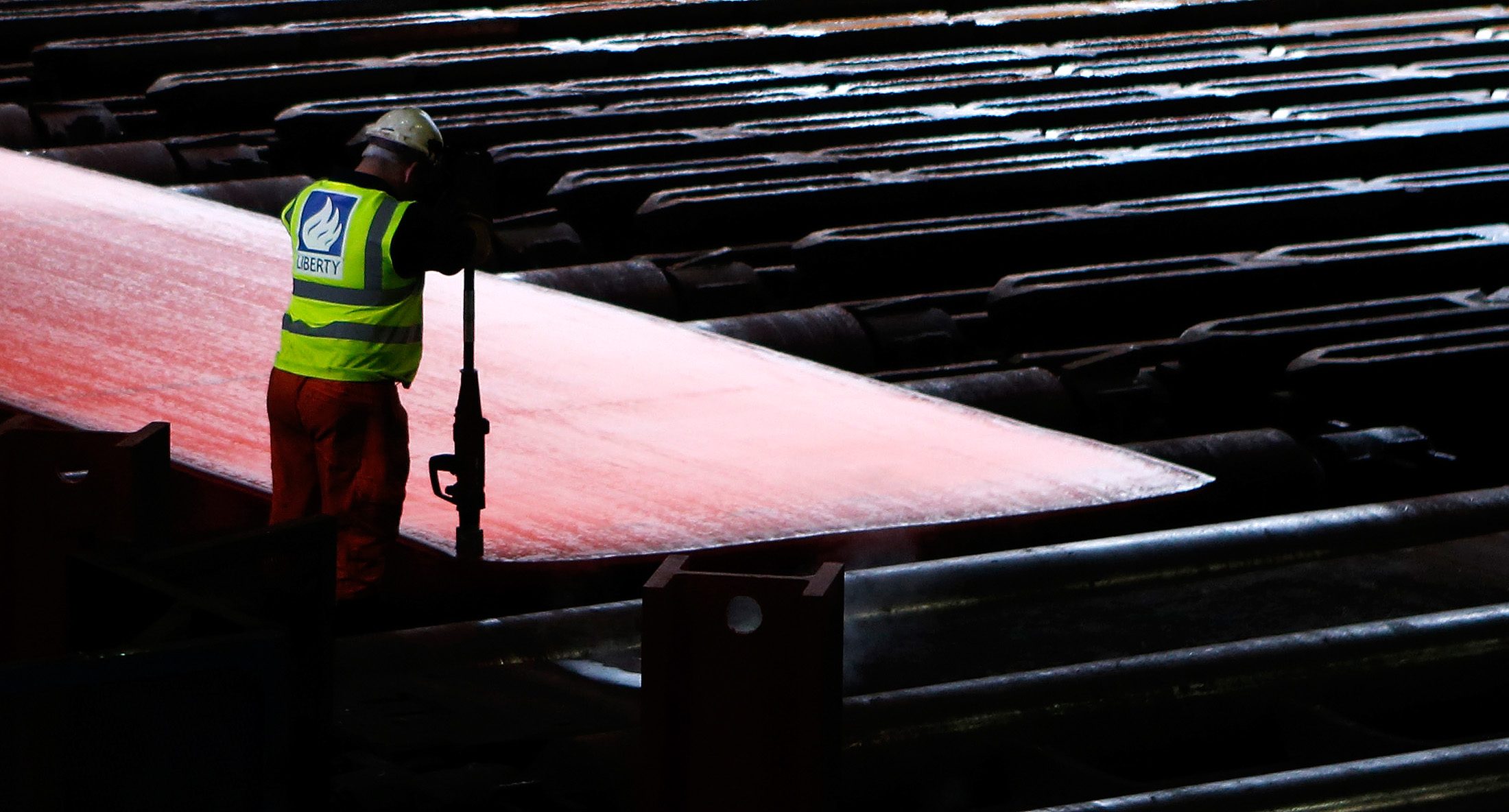 Steel in the rolling mill following the recommissioning of the works by Liberty Steel Group at the Dalzell steel plant in Motherwell in the UK. Liberty is one of the world's biggest steel producers