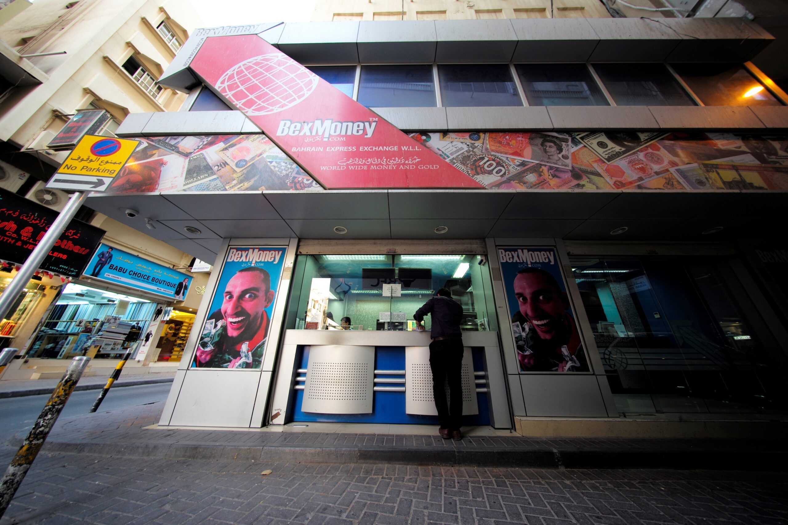A man uses a money transfer shop in Manama, Bahrain. Expat workers in Bahrain sent home $2.7bn in 2022