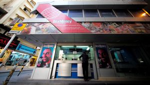 A man uses a money transfer shop in Manama, Bahrain. Expat workers in Bahrain sent home $2.7bn in 2022