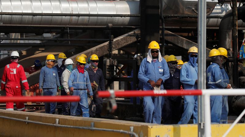Workers at the Saudi Aramco oil facility in Abqaiq. The kingdom's economy is still largely oil-based but the budget does not reveal the prices used in its calculations
