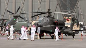 Visitors inspect a combat helicopter at a Riyadh defence show. Saudi Arabia is one of the world's biggest military spenders