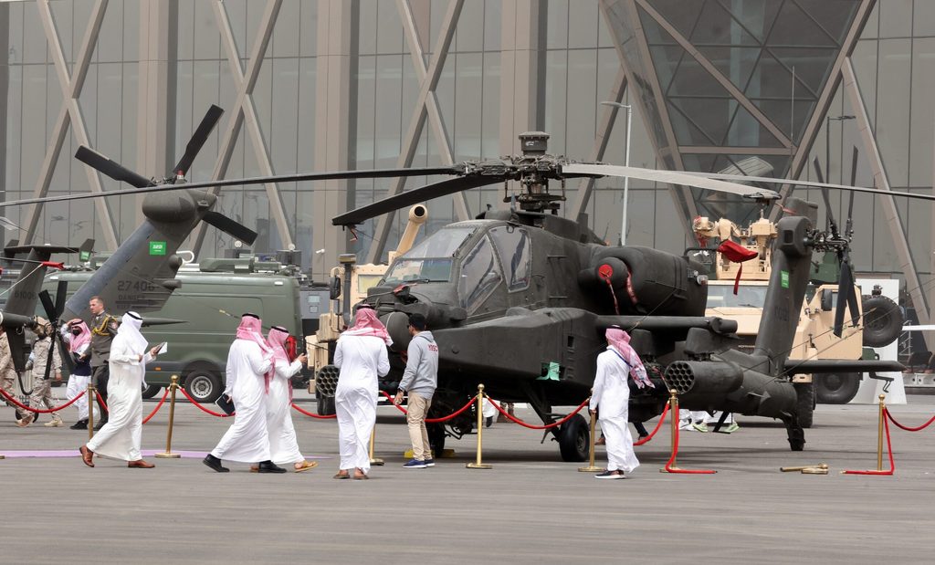 Visitors inspect a combat helicopter at a Riyadh defence show. Saudi Arabia is one of the world's biggest military spenders