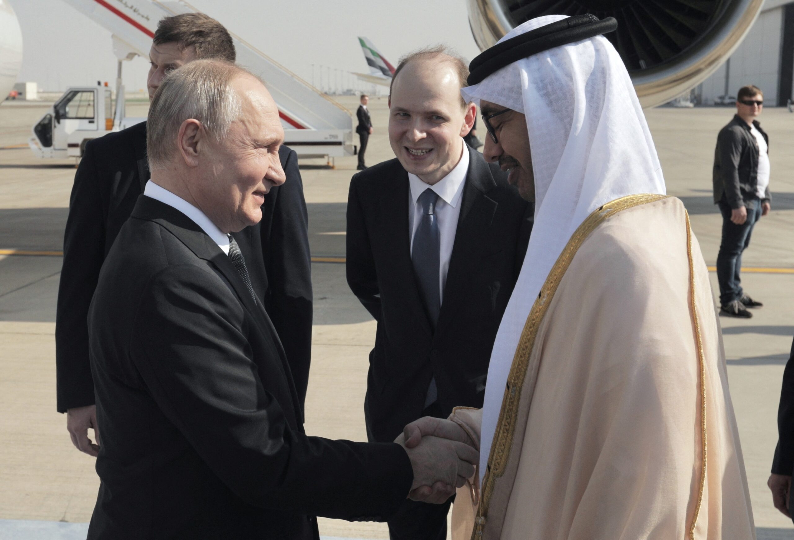 President Vladimir Putin is greeted by the UAE's foreign affairs minister, Sheikh Abdullah bin Zayed, at Abu Dhabi airport on Wednesday