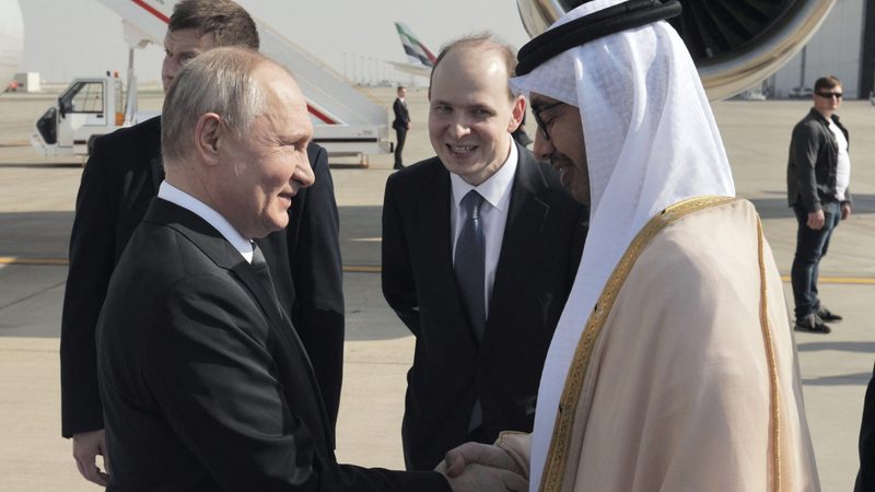 President Vladimir Putin is greeted by the UAE's foreign affairs minister, Sheikh Abdullah bin Zayed, at Abu Dhabi airport on Wednesday