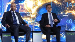 Khalid Al Falih, Saudi Arabia's investment minister, and Paul Chan Mo-po, Hong Kong's financial secretary, at the FII Priority summit