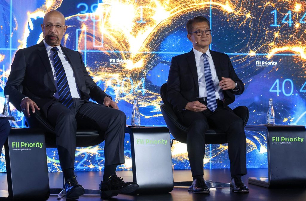 Khalid Al Falih, Saudi Arabia's investment minister, and Paul Chan Mo-po, Hong Kong's financial secretary, at the FII Priority summit