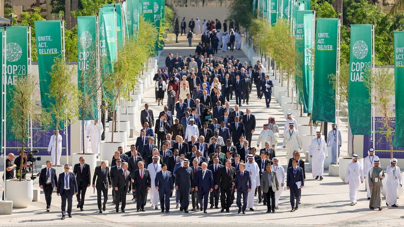 World leaders walk down Al Wasl avenue after their group photo on the first day of Cop28 at Expo City in Dubai