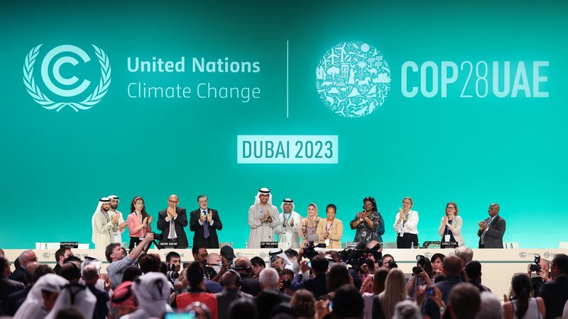 Cop28 president Sultan Al Jaber leads the applause during the Closing Plenary session