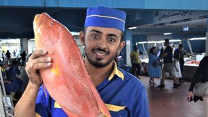 A seller in Jeddah's fish market, where freshly caught fish are sold at 100 stalls from 5am every day