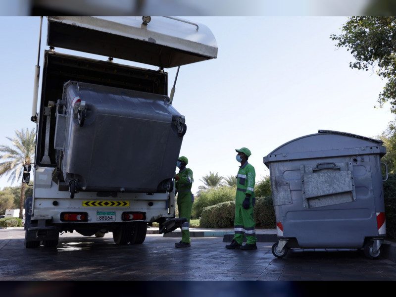 Tadweer employees at work. The company will report on the waste management sector's emissions at next year's Cop meeting