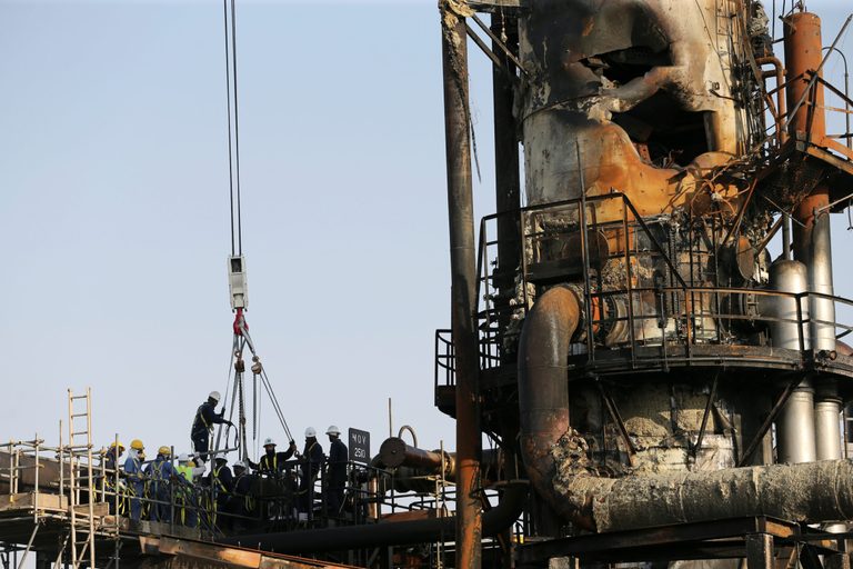 Workers repair the Saudi Aramco oil facility in Abqaiq after strikes in September 2019. A repeat of these attacks is thought to be unlikely 