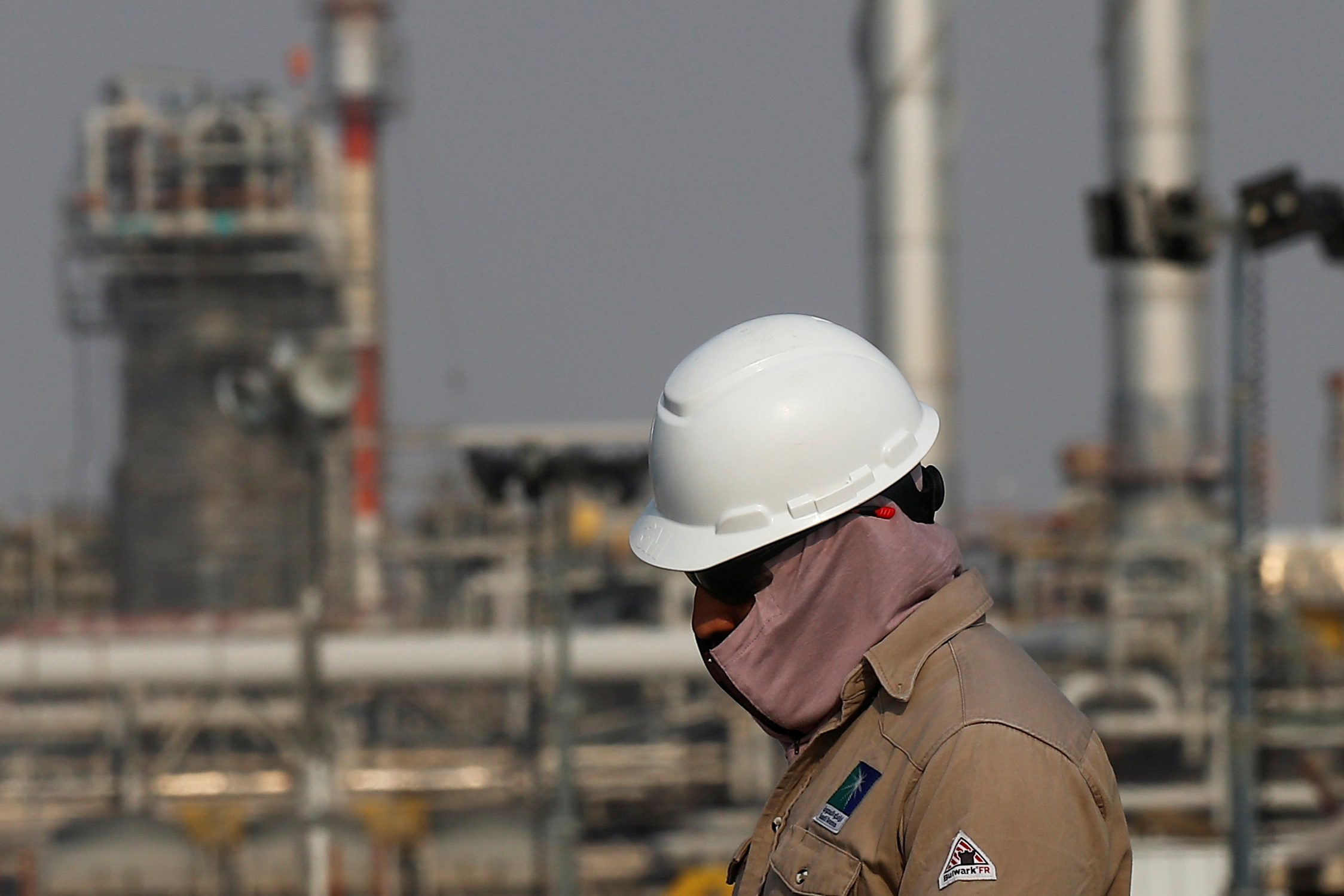 A Saudi Aramco worker at its oil facility in Abqaiq. Arab Light crude will cost $2 less per barrel in February