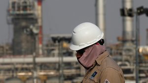 A Saudi Aramco worker at its oil facility in Abqaiq. Arab Light crude will cost $2 less per barrel in February
